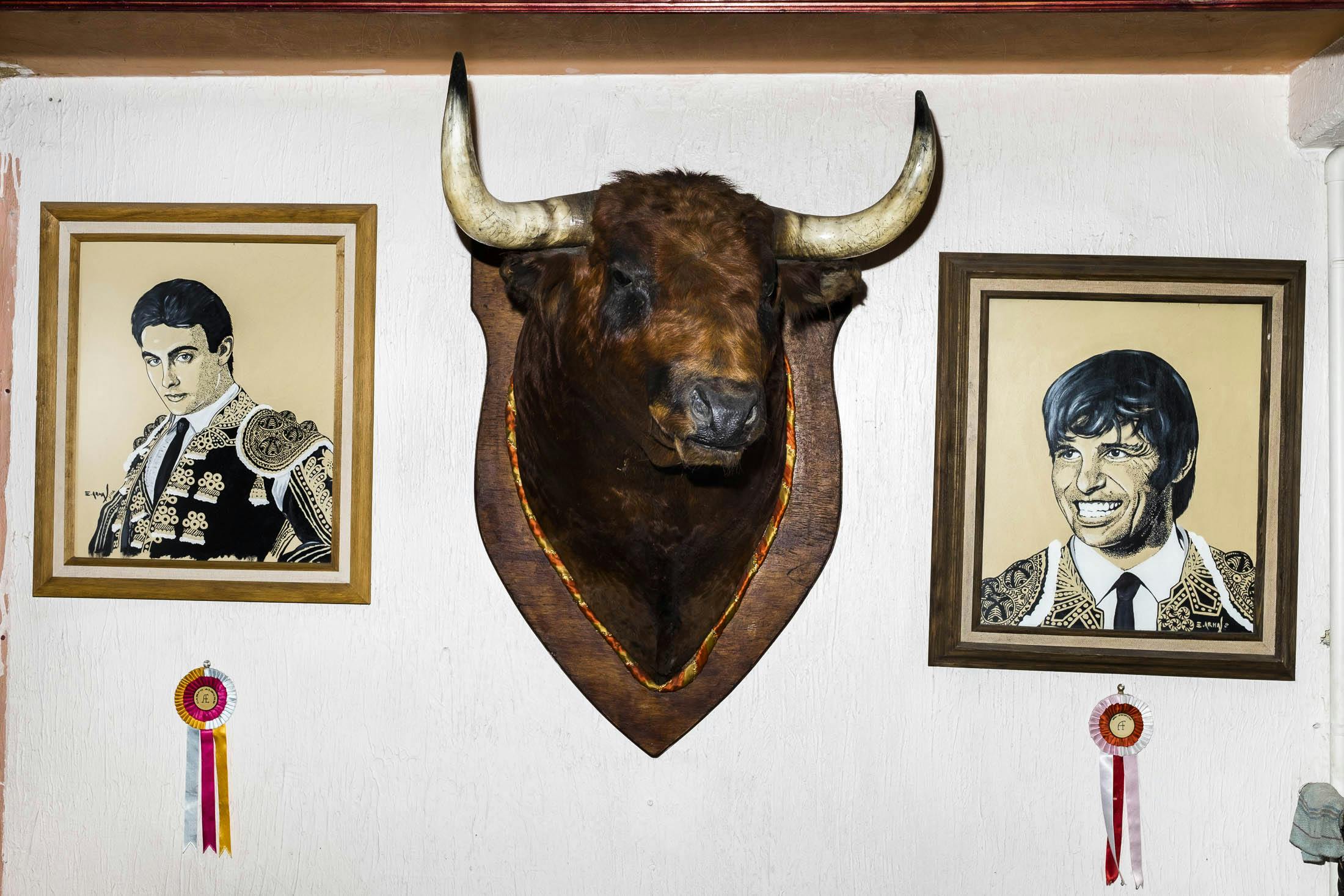 Matadors and bulls head on wall in Mexico
