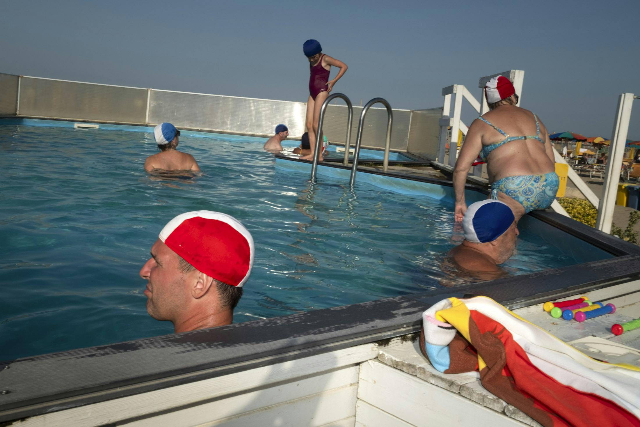 red swimming hat in swimming pool in italy