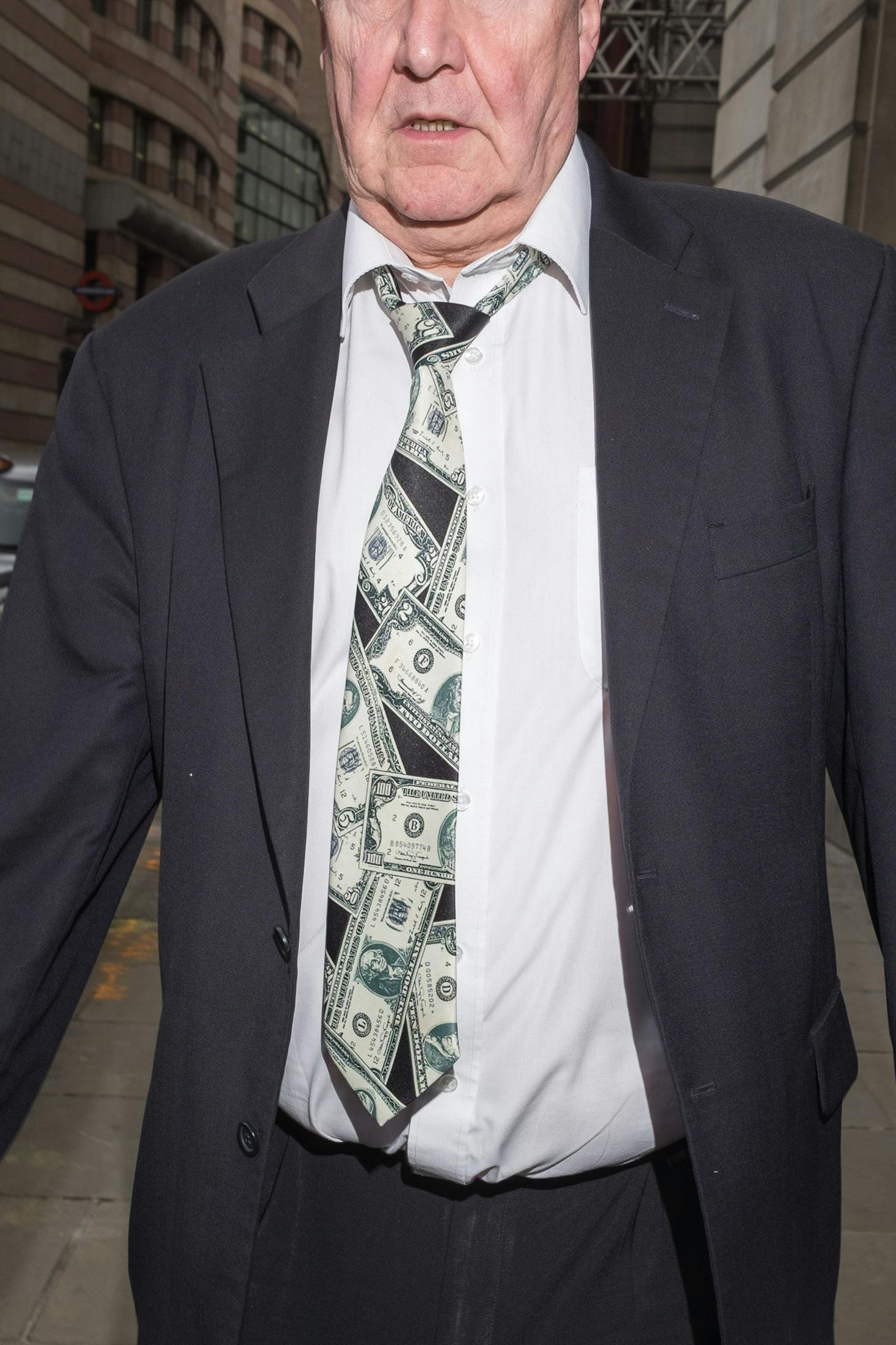 Man wearing dollar bill tie