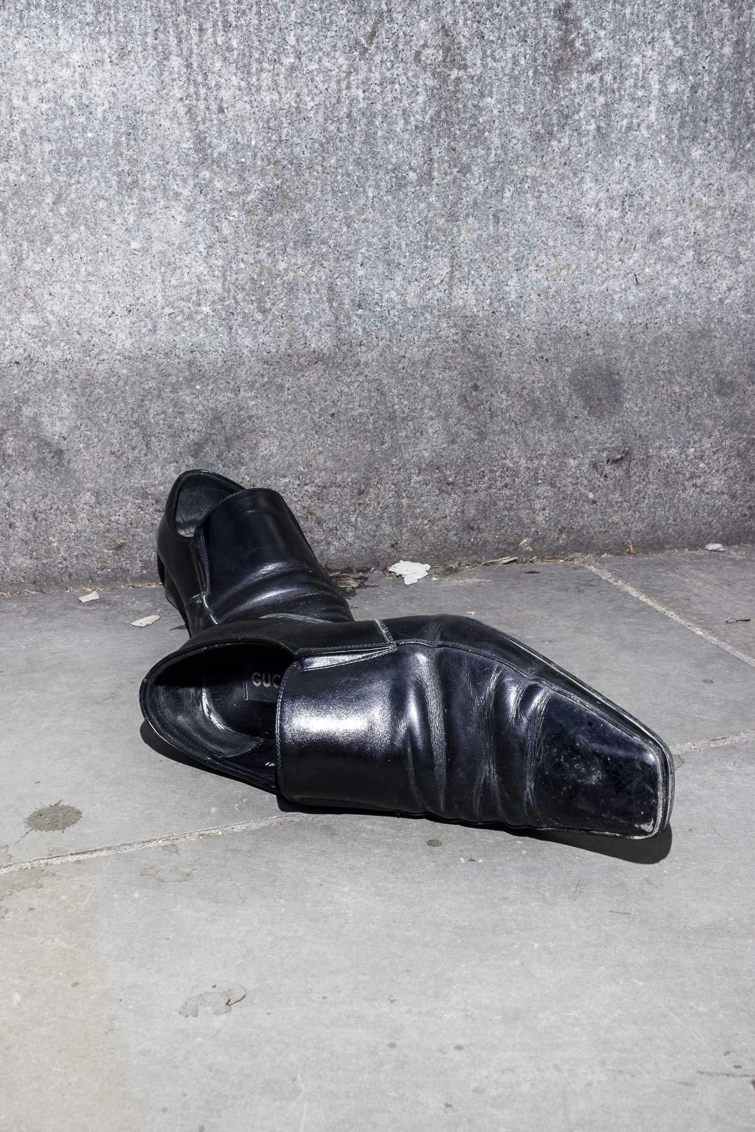 Discarded Gucci shoes in central london