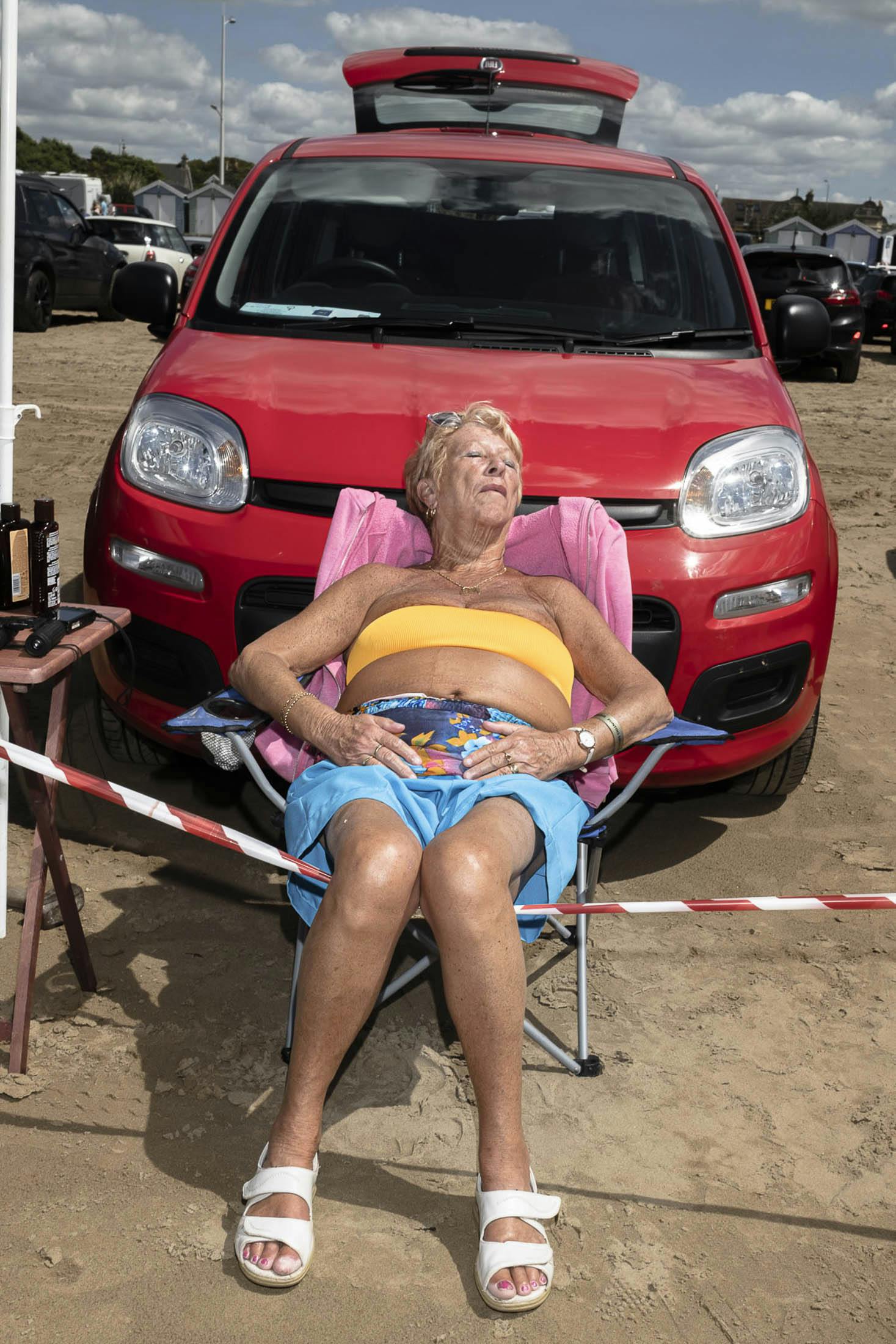 Woman sun bathing in Weston-super-Mare